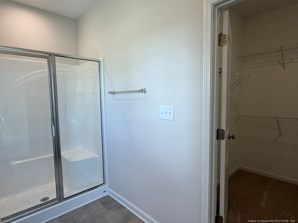 5409 Short Leaf Road Fayetteville, NC 28311 - Photo 28 of 40 a bathroom with a glass shower door