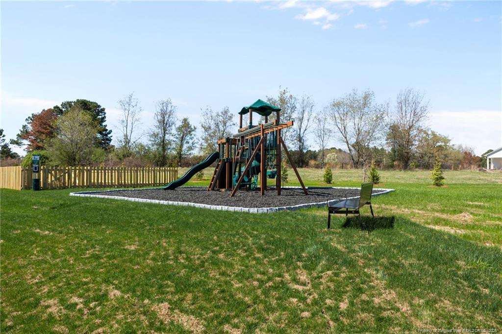 5409 Short Leaf Road Fayetteville, NC 28311 - Photo 34 of 40 a view of a park with swings and slides
