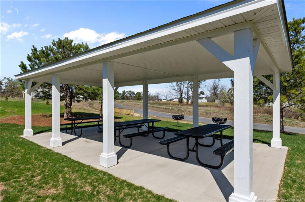 5409 Short Leaf Road Fayetteville, NC 28311 - Photo 39 of 40 a view of a porch with chairs and backyard
