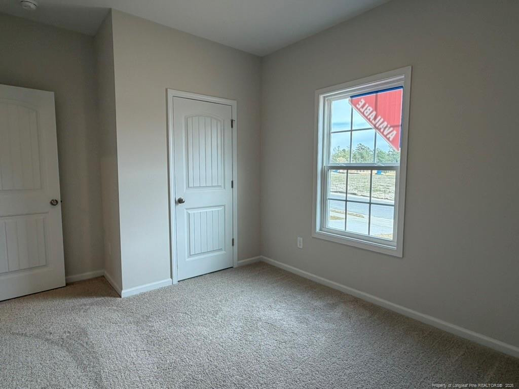 5409 Short Leaf Road Fayetteville, NC 28311 - Photo 5 of 40 an empty room with windows