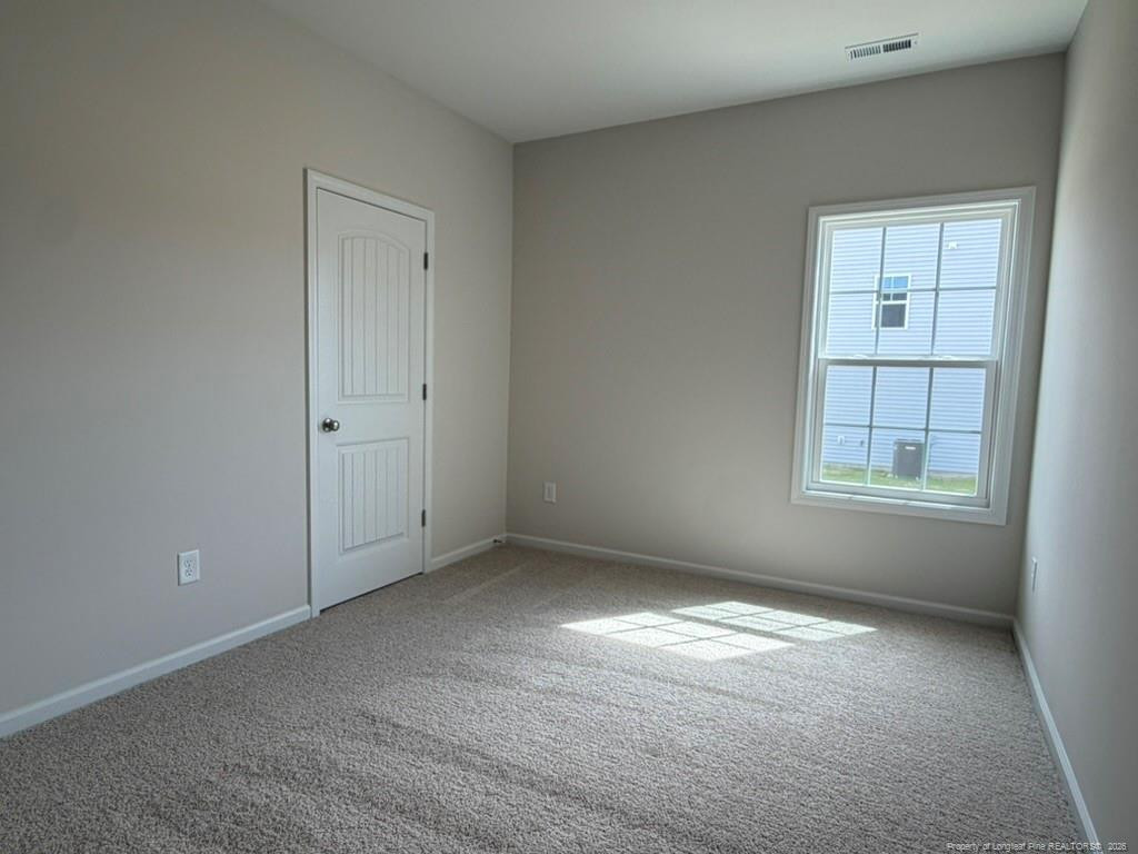5409 Short Leaf Road Fayetteville, NC 28311 - Photo 8 of 40 an empty room with windows