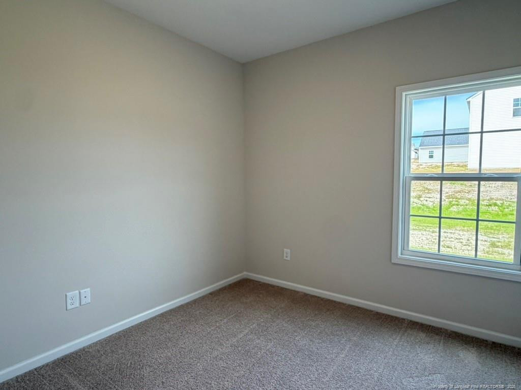 5409 Short Leaf Road Fayetteville, NC 28311 - Photo 9 of 40 an empty room with a window