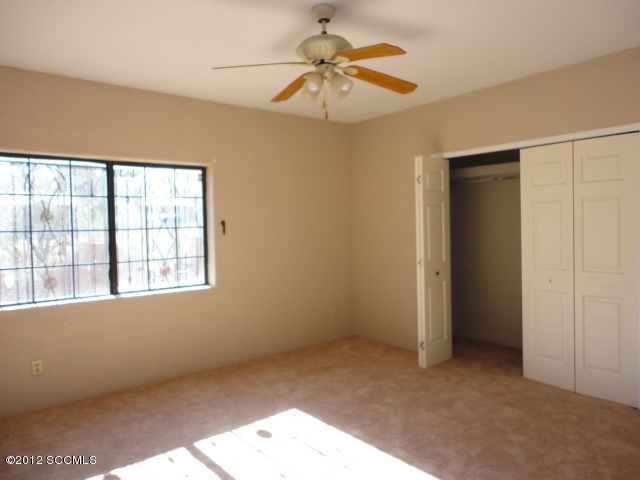 982 Circulo Golondrina Rio Rico, AZ 85648 - Photo 7 of 11 a view of an empty room with a window