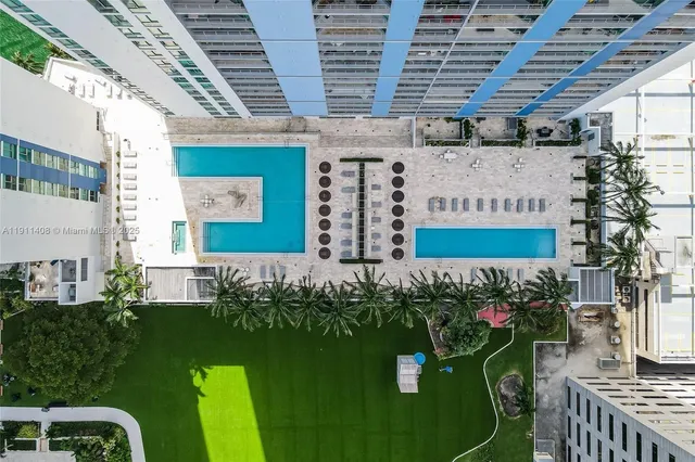 a view of a chairs and table in front of house