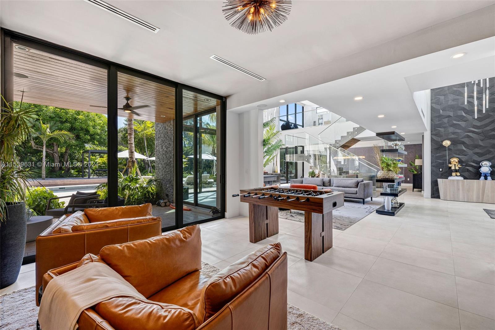 5840 Moss Ranch Road Pinecrest, FL 33156 - Photo 14 of 83 a living room with furniture and a large window