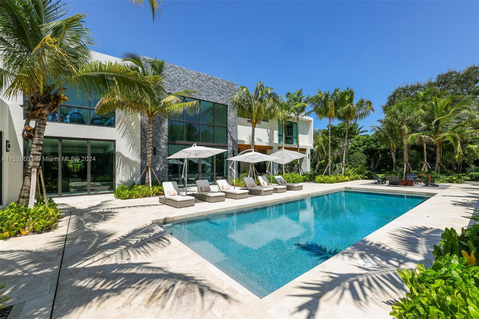 5840 Moss Ranch Road Pinecrest, FL 33156 - Photo 2 of 83 a view of a house with pool and sitting area