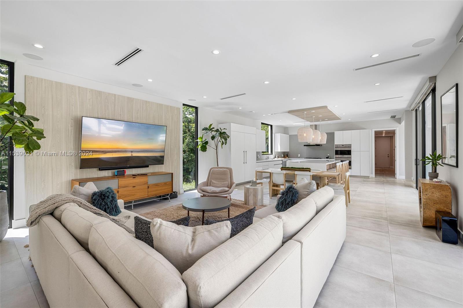 5840 Moss Ranch Road Pinecrest, FL 33156 - Photo 22 of 83 a living room with furniture and a flat screen tv