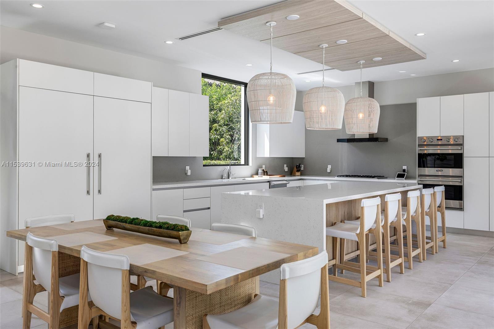 5840 Moss Ranch Road Pinecrest, FL 33156 - Photo 24 of 83 a kitchen with appliances a sink and cabinets