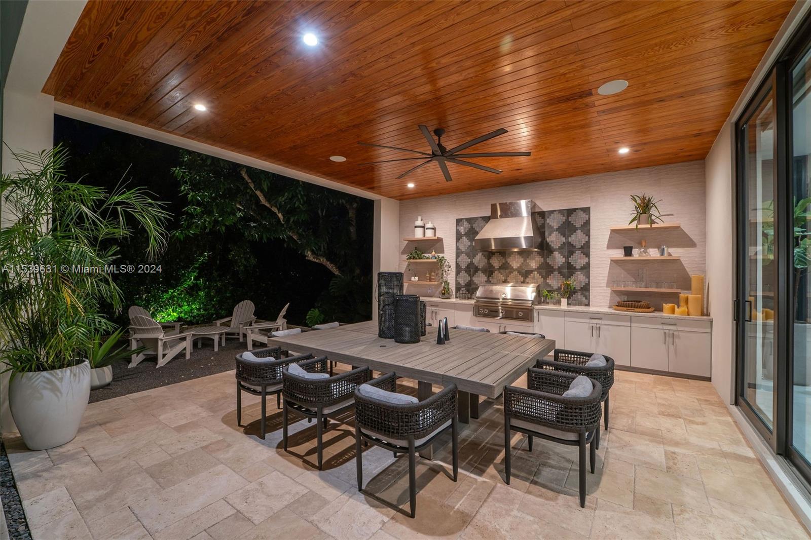 5840 Moss Ranch Road Pinecrest, FL 33156 - Photo 27 of 83 a outdoor space with lots of tables a garden and chairs