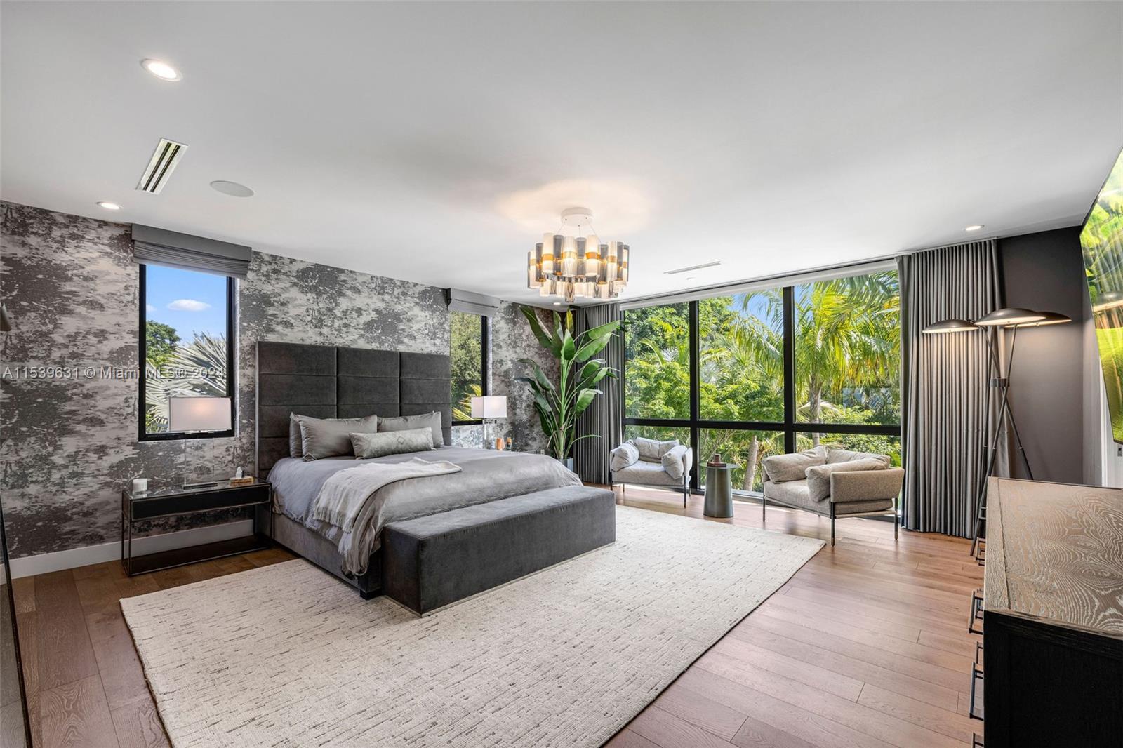 5840 Moss Ranch Road Pinecrest, FL 33156 - Photo 38 of 83 a bedroom with a large bed and a large window