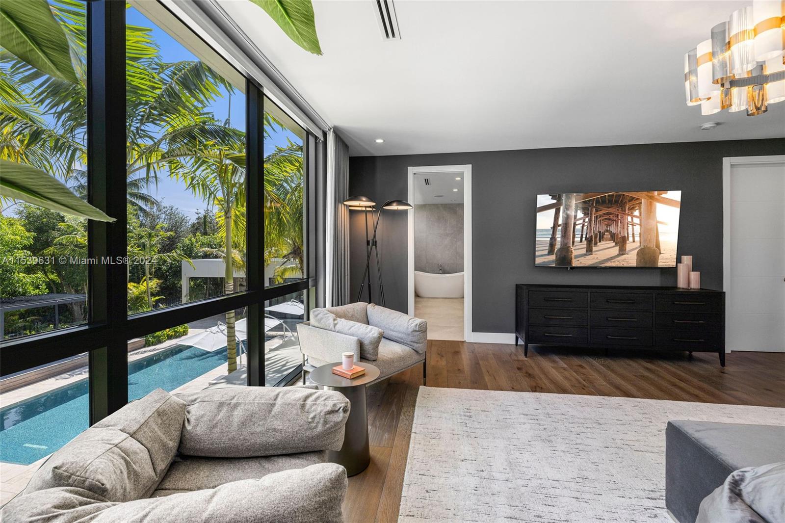 5840 Moss Ranch Road Pinecrest, FL 33156 - Photo 42 of 83 a living room with furniture and a large window