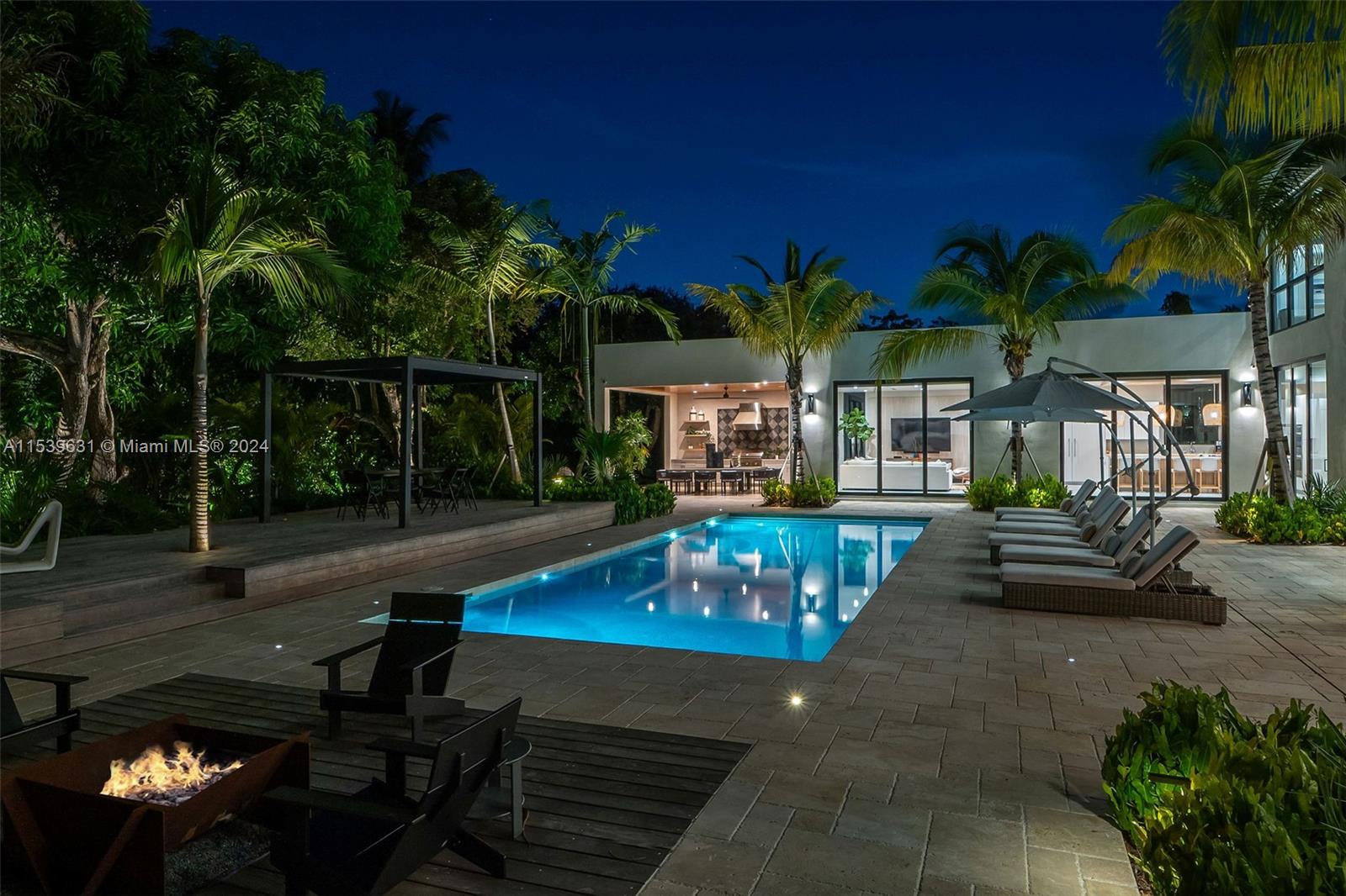 5840 Moss Ranch Road Pinecrest, FL 33156 - Photo 59 of 83 a view of a patio with swimming pool table and chairs