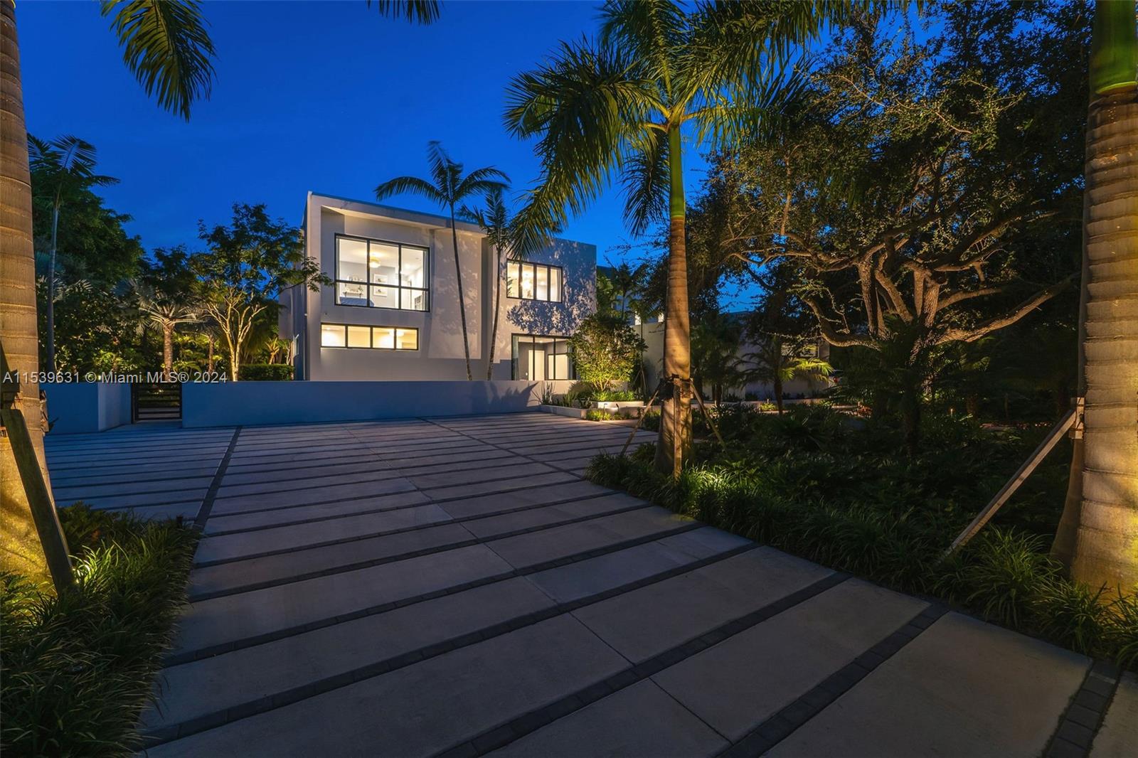 5840 Moss Ranch Road Pinecrest, FL 33156 - Photo 74 of 83 a view of a house front with a yard