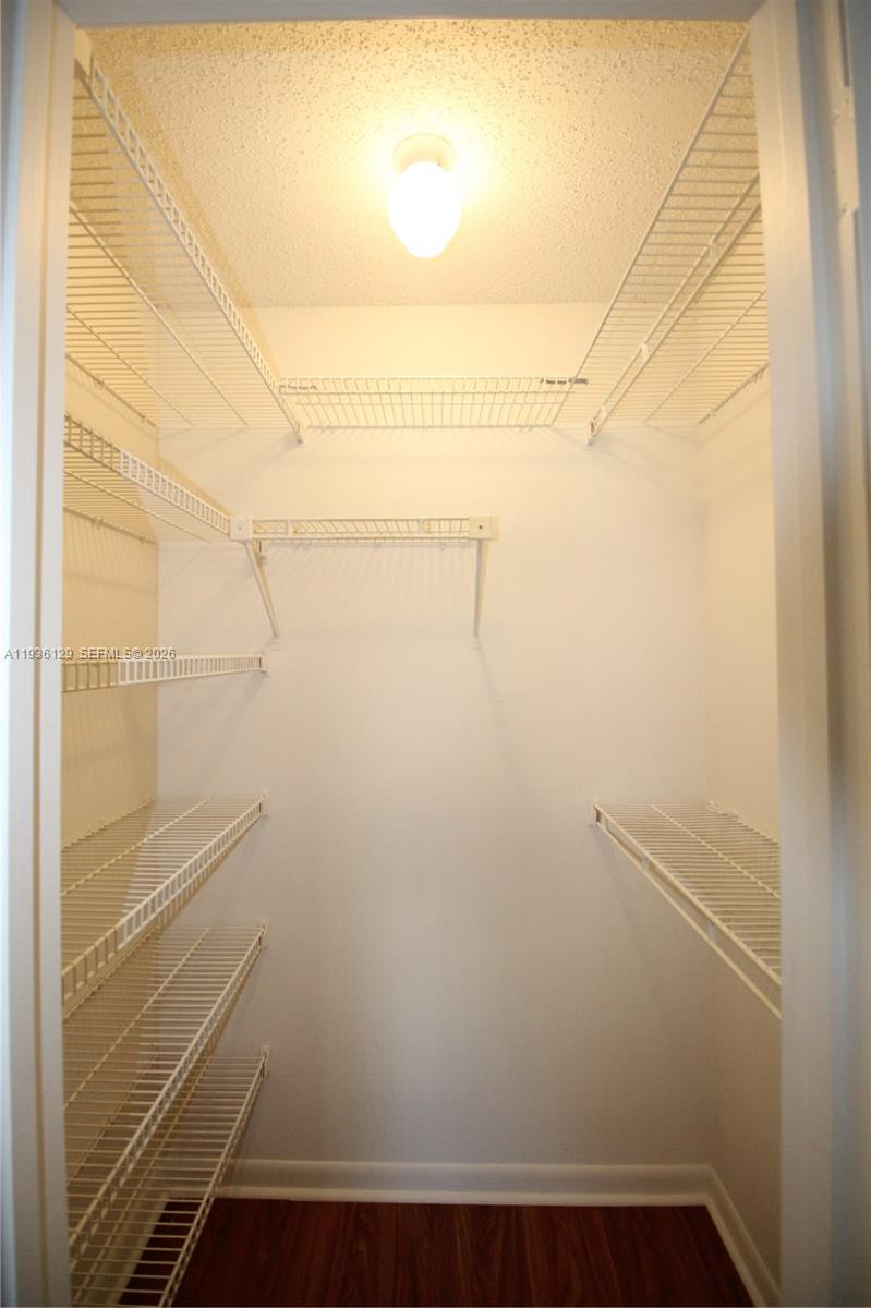 8990 West Sample Road, Unit 206 Coral Springs, FL 33065 - Photo 12 of 28 a view of small space with empty racks