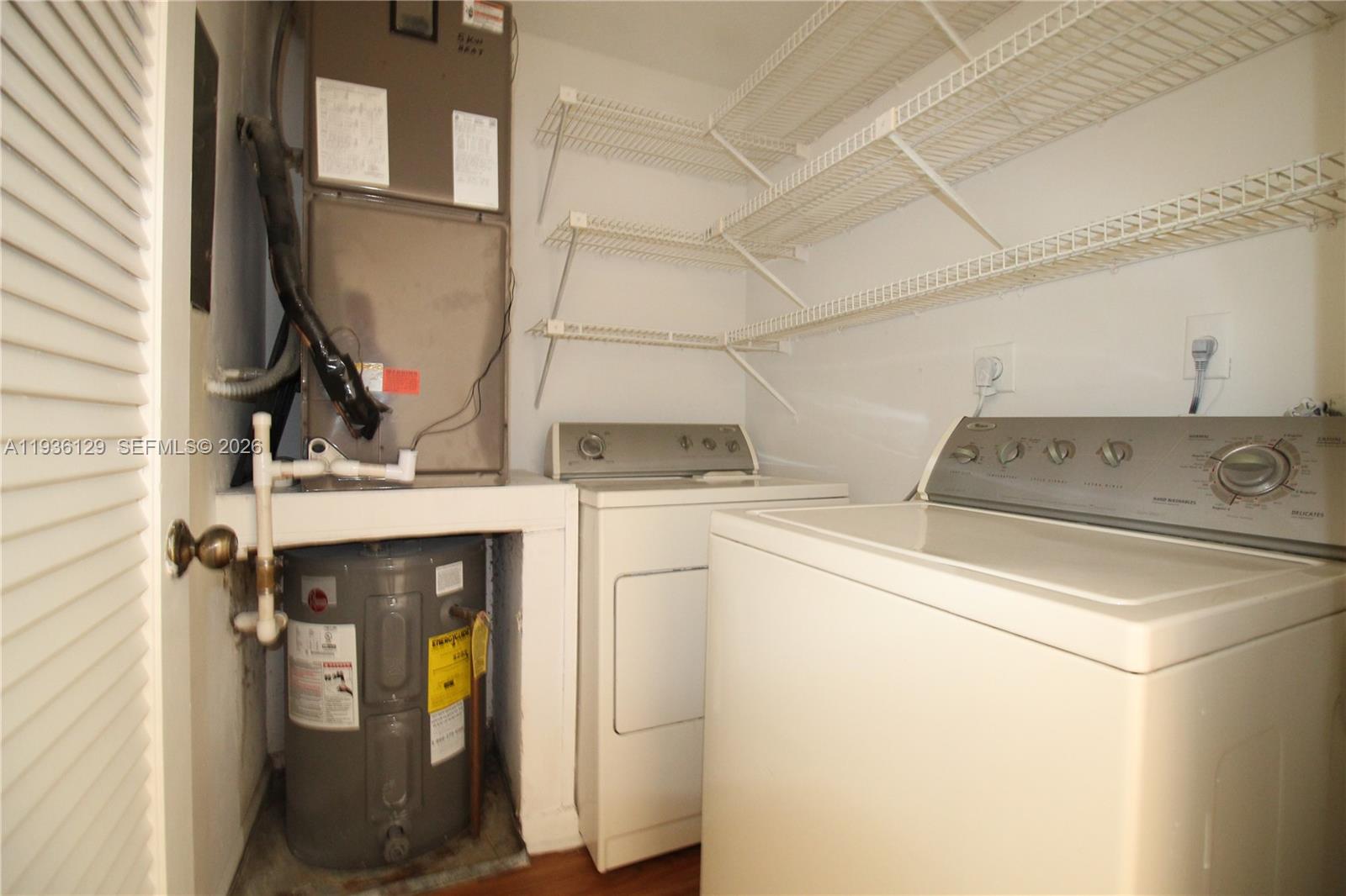 8990 West Sample Road, Unit 206 Coral Springs, FL 33065 - Photo 14 of 28 a utility room with dryer and washer