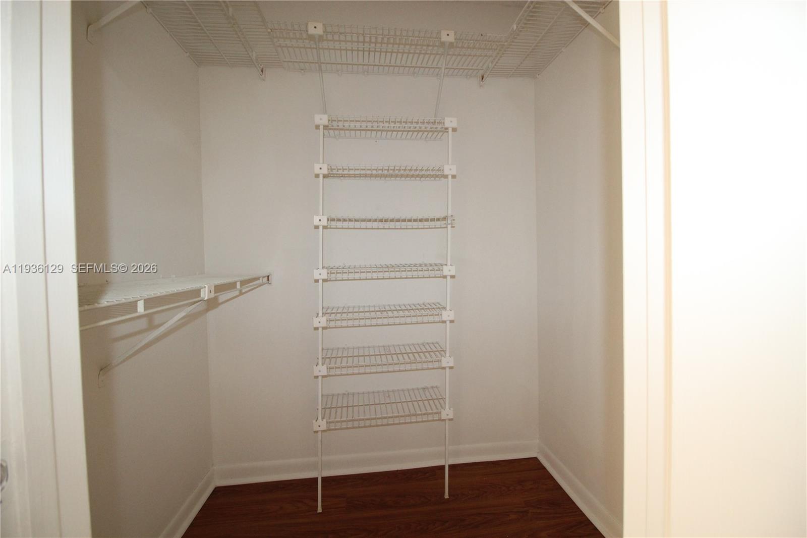 8990 West Sample Road, Unit 206 Coral Springs, FL 33065 - Photo 15 of 28 a view of walk in closet with empty racks