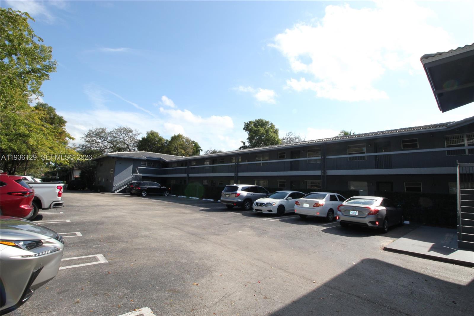 8990 West Sample Road, Unit 206 Coral Springs, FL 33065 - Photo 28 of 28 a view of street with parked cars