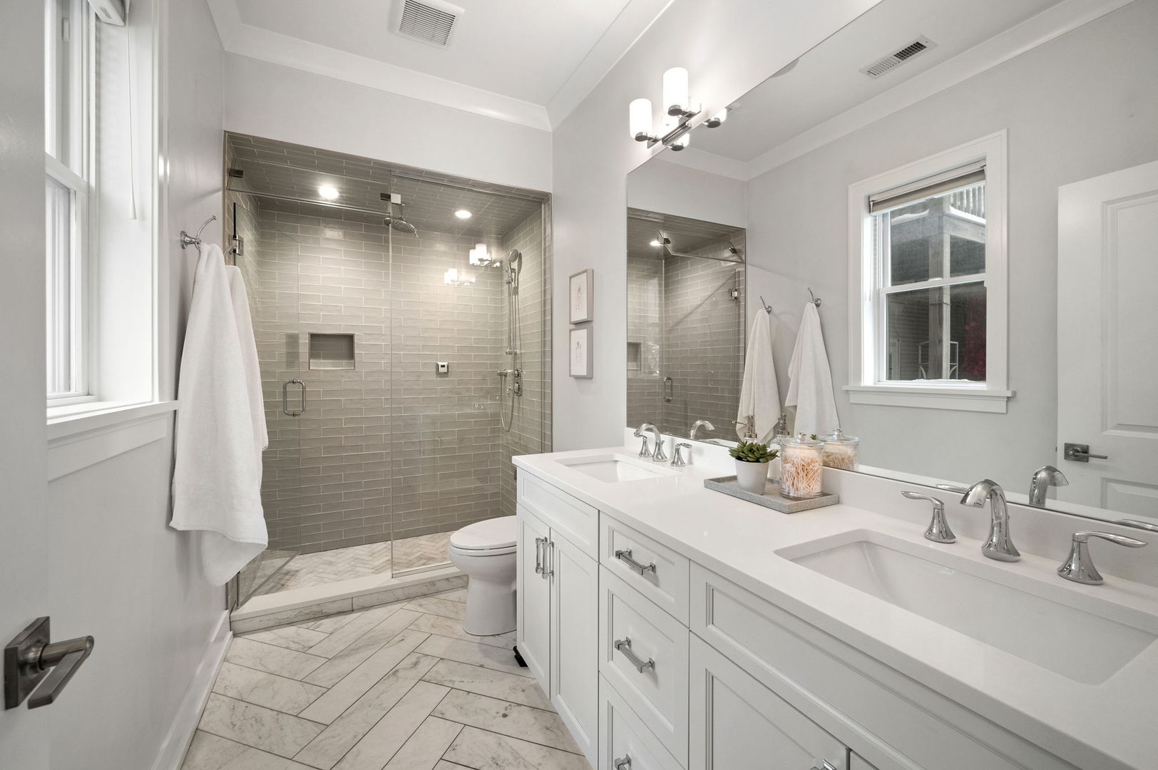 1341 West George Street, Unit 2 Chicago, IL 60657 - Photo 15 of 20 a bathroom with a double vanity sink toilet mirror and shower