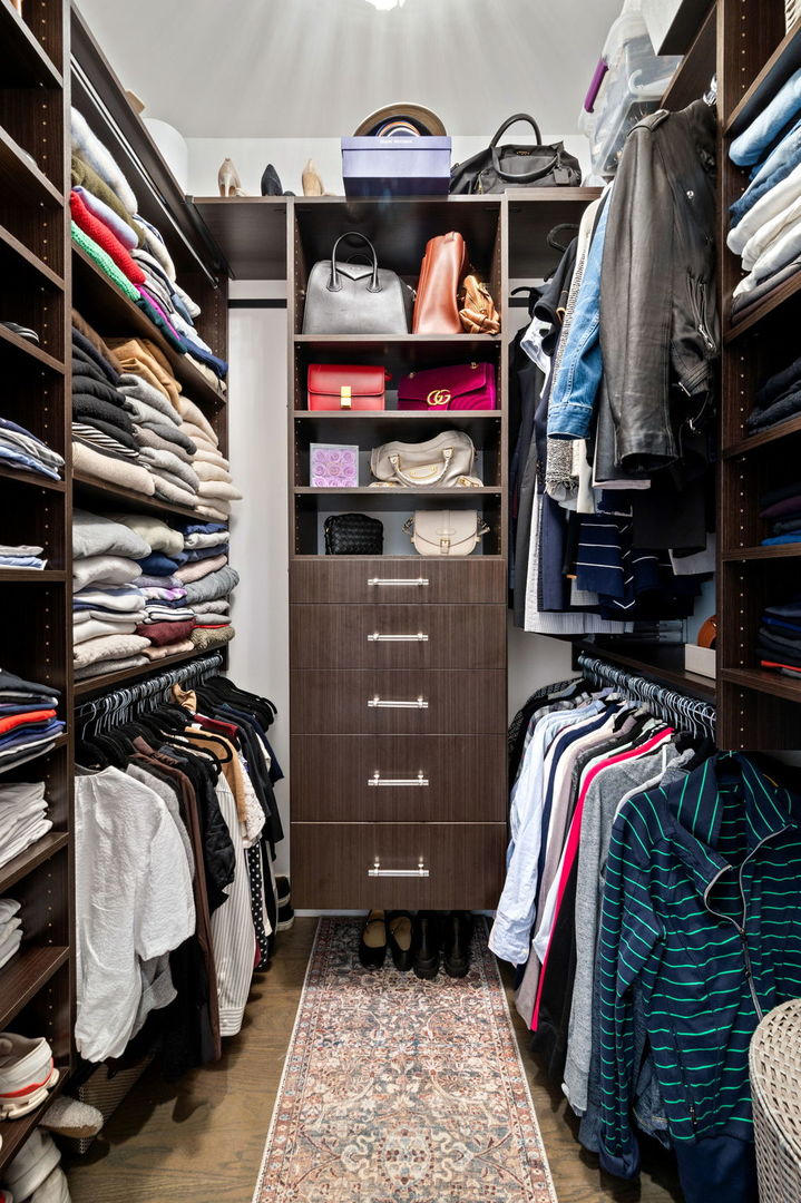 1341 West George Street, Unit 2 Chicago, IL 60657 - Photo 16 of 20 a view of walk in closet with clothes and shoes