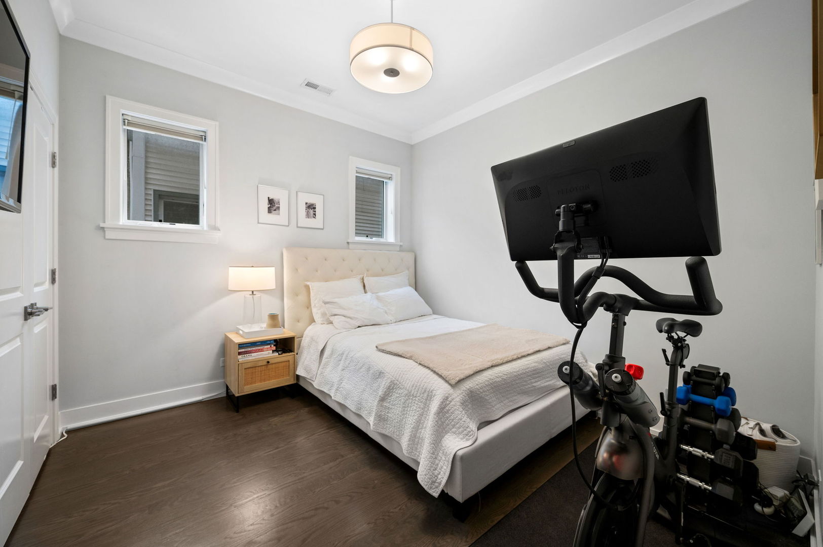 1341 West George Street, Unit 2 Chicago, IL 60657 - Photo 17 of 20 a bedroom with a bed and a chandelier