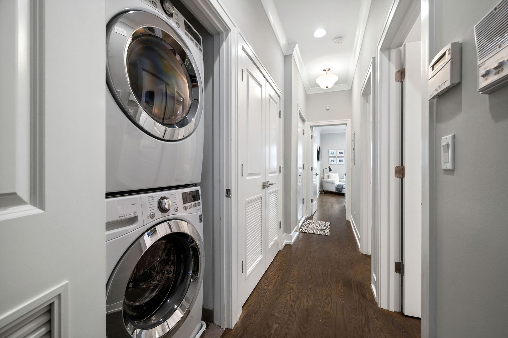 1341 West George Street, Unit 2 Chicago, IL 60657 - Photo 19 of 20 a view of a hallway with washer and dryer