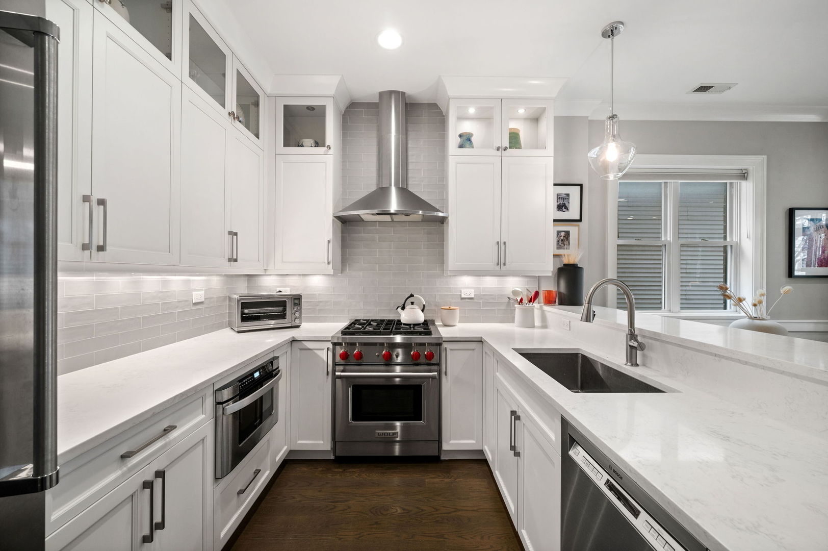 1341 West George Street, Unit 2 Chicago, IL 60657 - Photo 9 of 20 a kitchen with stainless steel appliances granite countertop a sink stove and cabinets