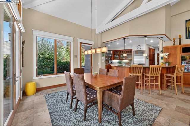 a dining room with a table and chairs