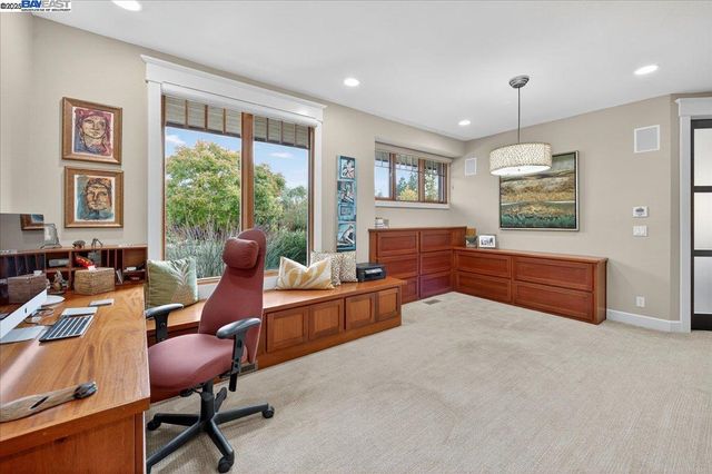 a spacious bathroom with a toilet a sink and mirror