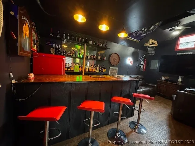a living room with furniture a rug and a projector