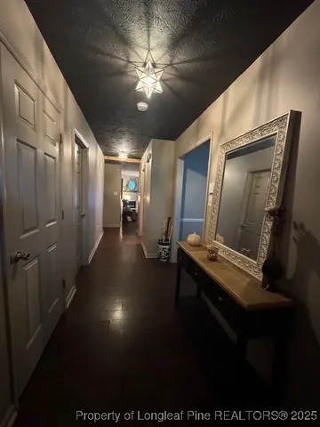 a view of a hallway with workspace