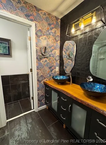 a bathroom with a sink and a mirror