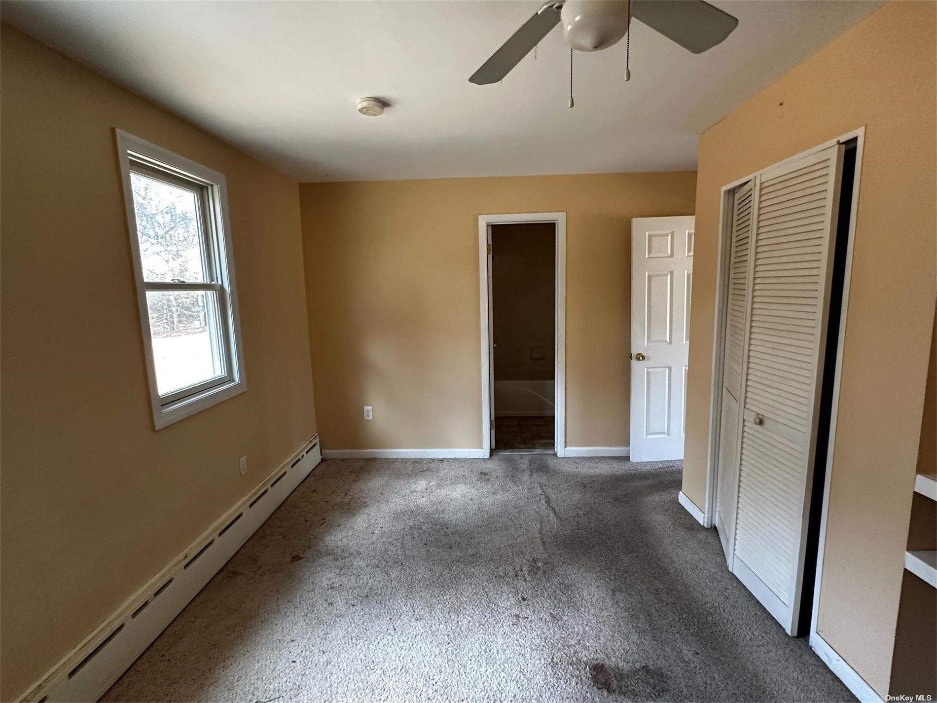 2468 River Road Calverton, NY 11933 - Photo 20 of 20 a view of an empty room with a window