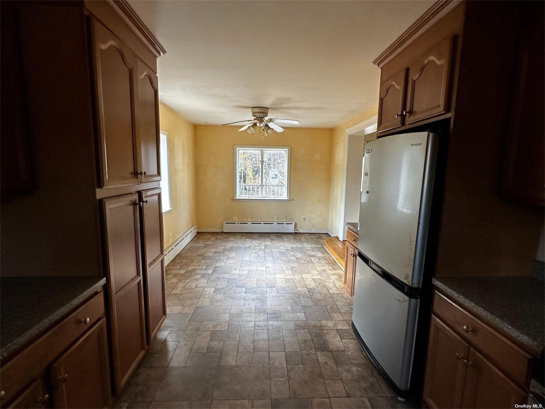 2468 River Road Calverton, NY 11933 - Photo 10 of 20 a view of an empty room with a window