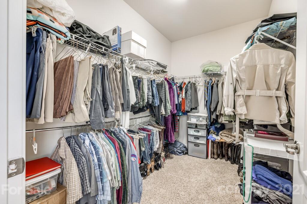 1592 Spring Blossom Trail Fort Mill, SC 29708 - Photo 11 of 36 a view of walk in closet with clothes and shoes