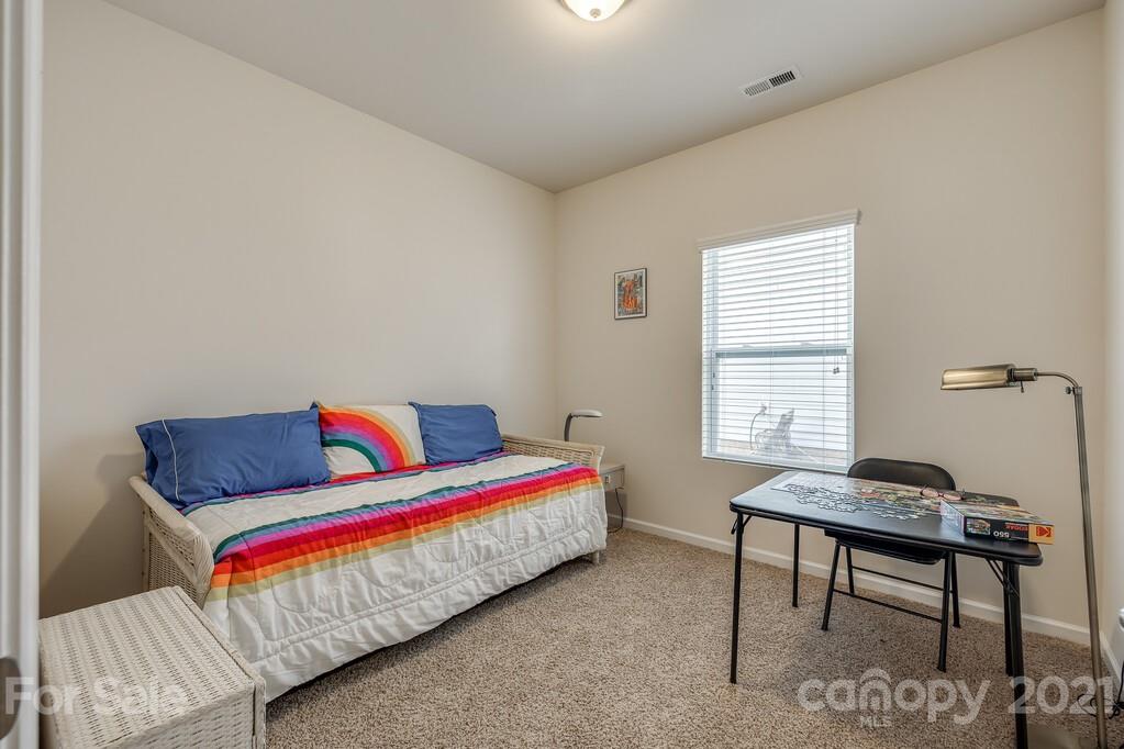 1592 Spring Blossom Trail Fort Mill, SC 29708 - Photo 16 of 36 a living room with a couch and a window