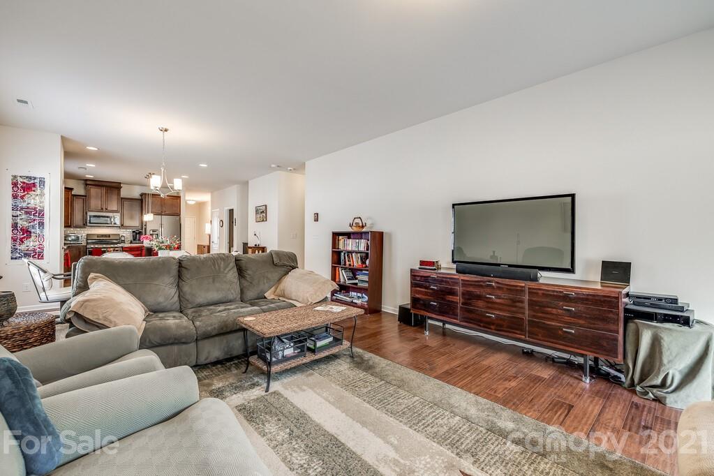 1592 Spring Blossom Trail Fort Mill, SC 29708 - Photo 20 of 36 a living room with furniture and a flat screen tv