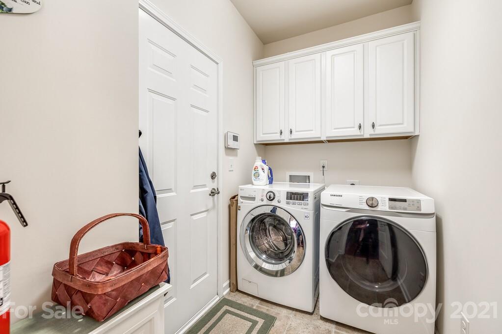 1592 Spring Blossom Trail Fort Mill, SC 29708 - Photo 31 of 36 a utility room with sink dryer and washer