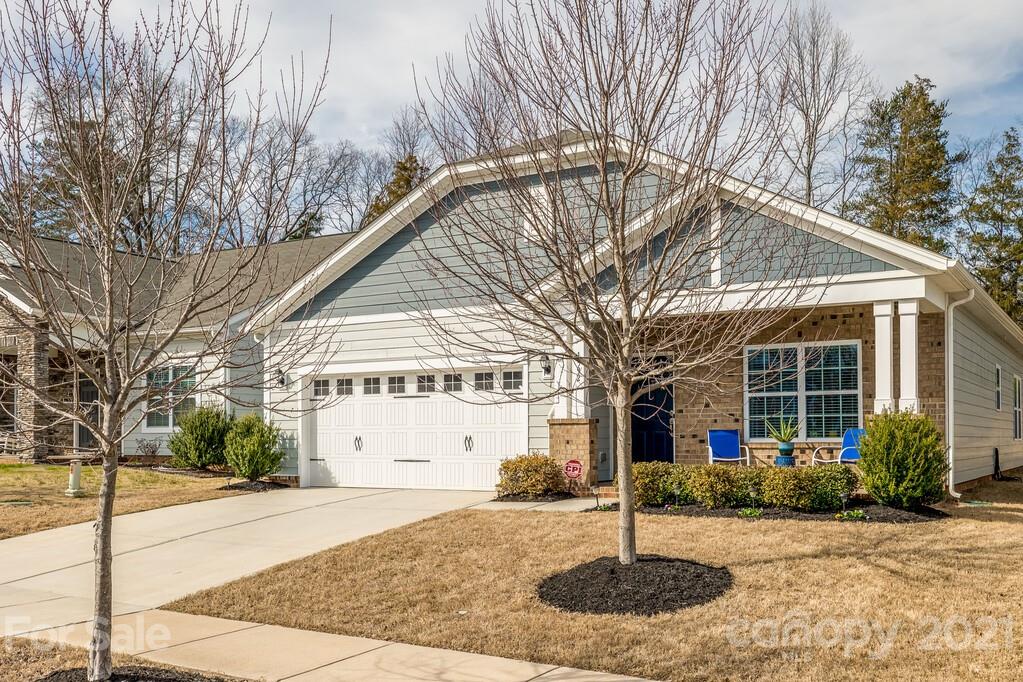 1592 Spring Blossom Trail Fort Mill, SC 29708 - Photo 32 of 36 a front view of a house with garden