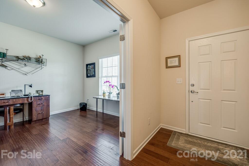 1592 Spring Blossom Trail Fort Mill, SC 29708 - Photo 34 of 36 a view of a room with wooden floor and window