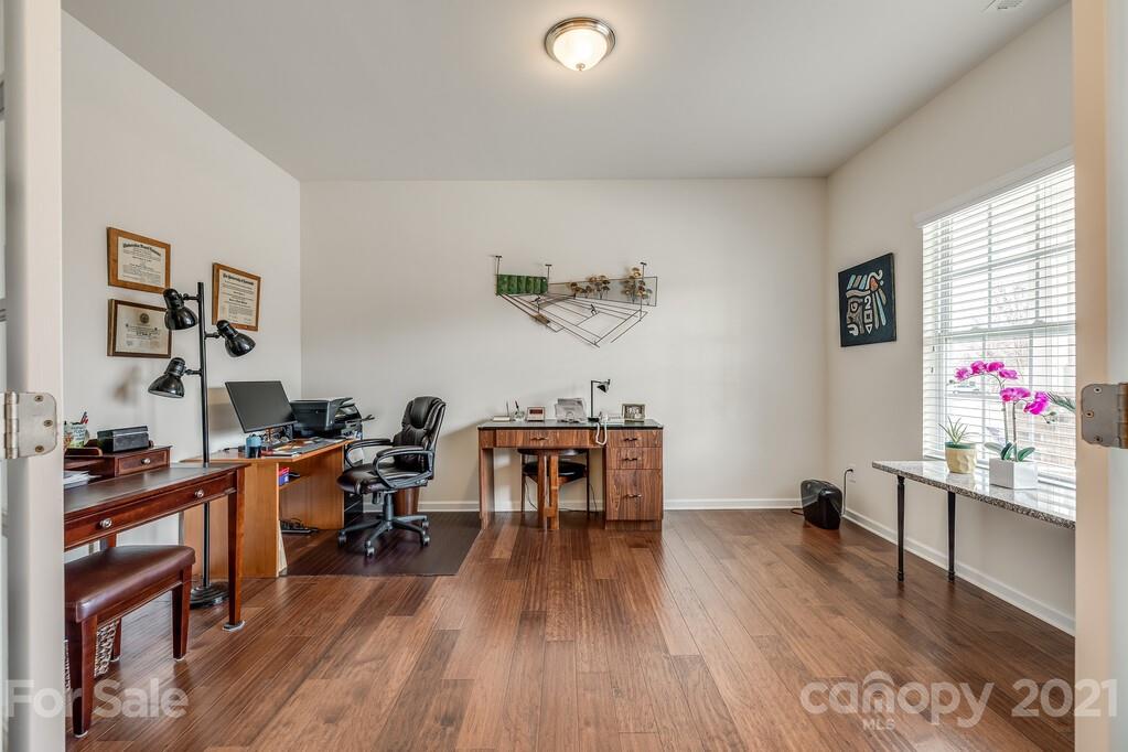 1592 Spring Blossom Trail Fort Mill, SC 29708 - Photo 35 of 36 a living room with furniture and wooden floor