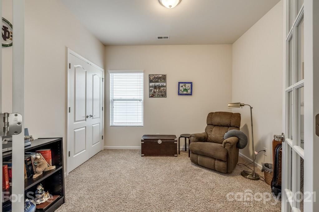 1592 Spring Blossom Trail Fort Mill, SC 29708 - Photo 10 of 36 a living room with furniture and a flat screen tv