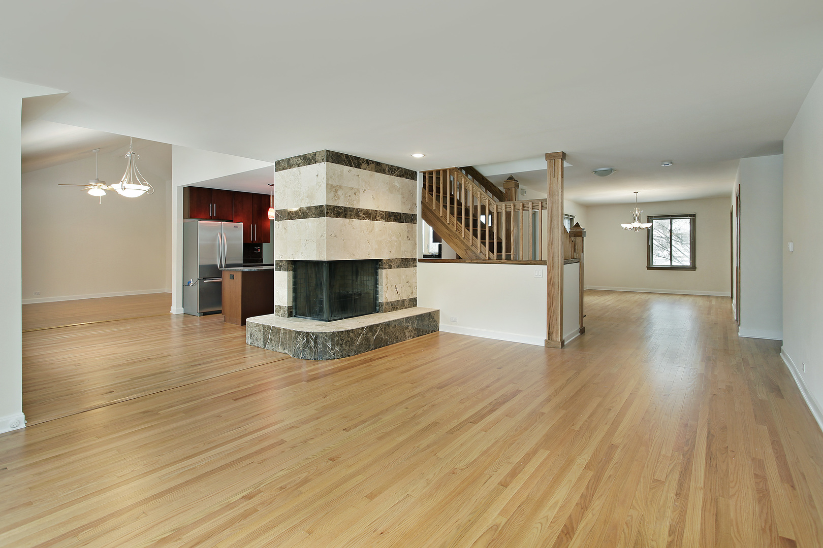 937 Illinois Road Wilmette, IL 60091 - Photo 3 of 16 a view of a kitchen with furniture and wooden floor