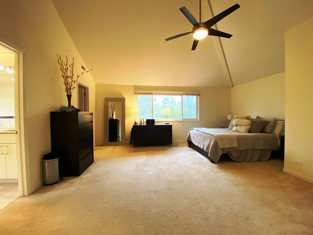 937 Illinois Road Wilmette, IL 60091 - Photo 8 of 16 a living room with furniture and a flat screen tv