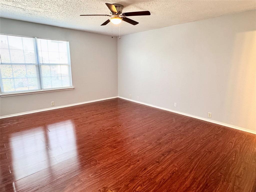 6723 Ambercrest Drive Arlington, TX 76002 - Photo 21 of 31 wooden floor in an empty room with a window