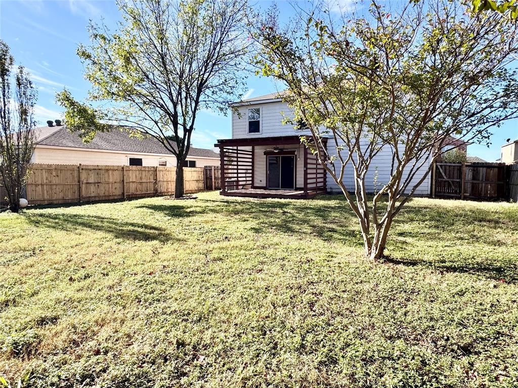 6723 Ambercrest Drive Arlington, TX 76002 - Photo 29 of 31 a view of a house with a yard