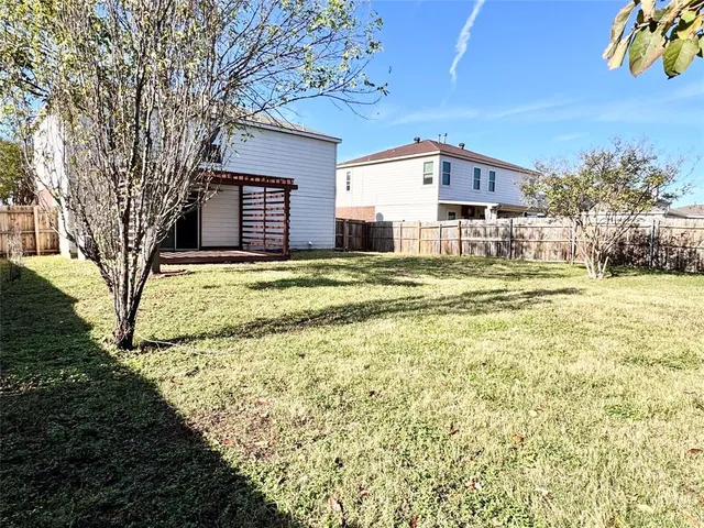 a big house with trees in front of it