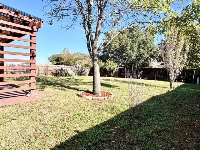 a view of yard with swimming pool
