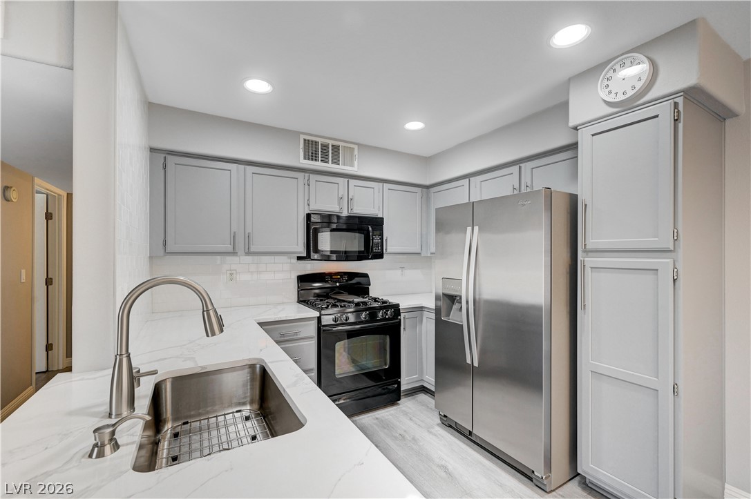3425 East Russell Road, Unit 223 Las Vegas, NV 89120 - Photo 9 of 47 Culinary delights await in this modern kitchen with stainless steel appliances and abundant counter space.