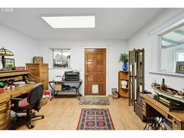 a bedroom with furniture and a window
