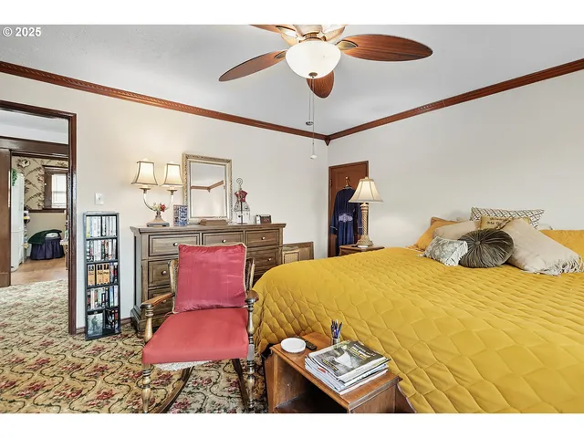 a bedroom with a bed and chandelier